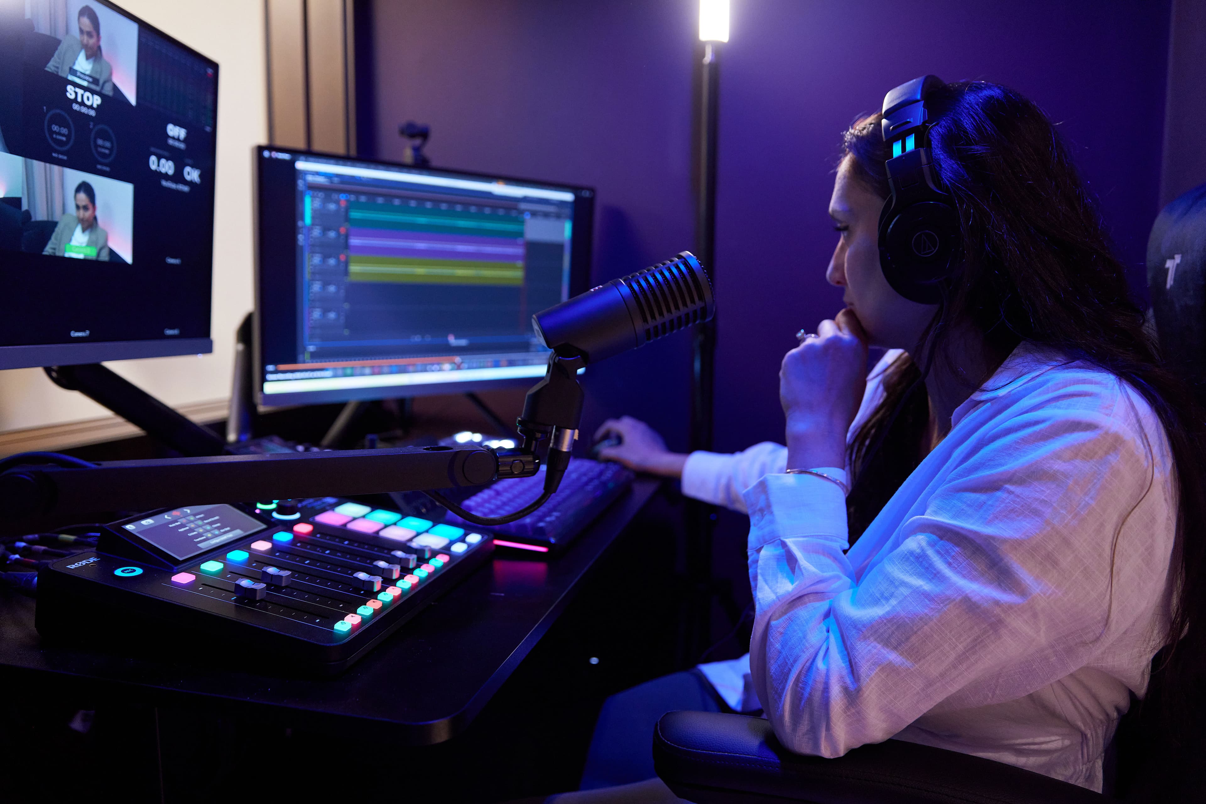 A producer behind the desk editing sound tracks